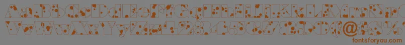ABraggadr Font – Brown Fonts on Gray Background