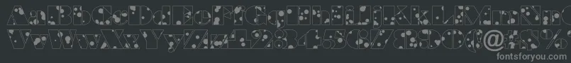ABraggadr-fontti – harmaat kirjasimet mustalla taustalla