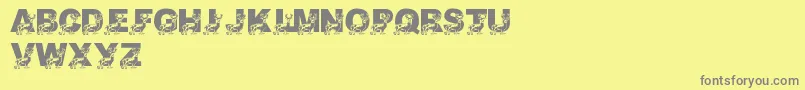 LmsDaddyDeer-fontti – harmaat kirjasimet keltaisella taustalla