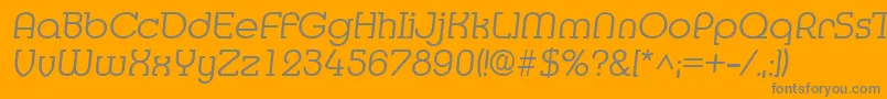 Czcionka MediaItalic – szare czcionki na pomarańczowym tle