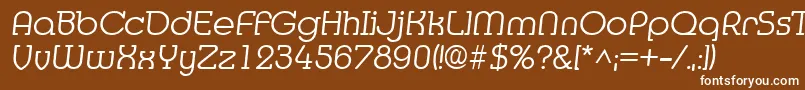 MediaItalic-fontti – valkoiset fontit ruskealla taustalla