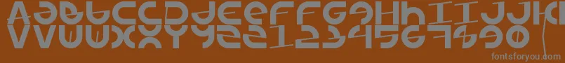 Armada1991-fontti – harmaat kirjasimet ruskealla taustalla