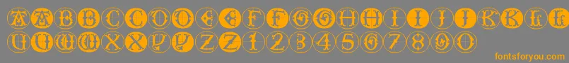 Toscanbuttons-Schriftart – Orangefarbene Schriften auf grauem Hintergrund