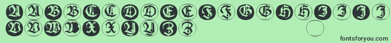 Шрифт Frakturinitialenangularround – чёрные шрифты на зелёном фоне