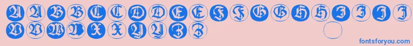 Frakturinitialenangularround-fontti – siniset fontit vaaleanpunaisella taustalla