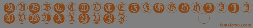 Шрифт Frakturinitialenangularround – коричневые шрифты на сером фоне