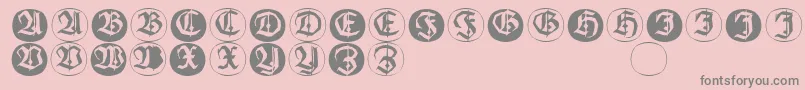 Frakturinitialenangularround-Schriftart – Graue Schriften auf rosa Hintergrund