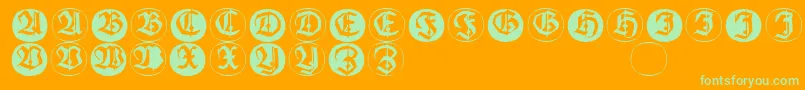 Шрифт Frakturinitialenangularround – зелёные шрифты на оранжевом фоне