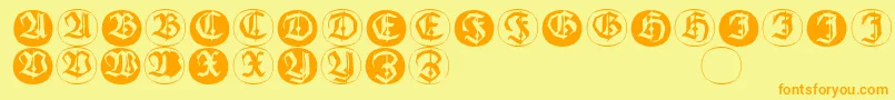 フォントFrakturinitialenangularround – オレンジの文字が黄色の背景にあります。
