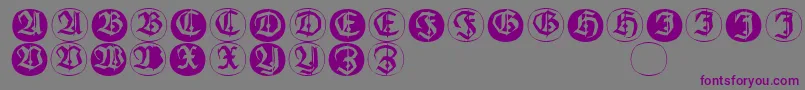 Frakturinitialenangularround-fontti – violetit fontit harmaalla taustalla