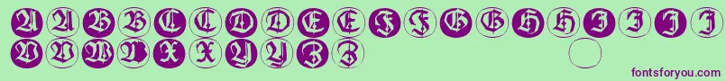 Шрифт Frakturinitialenangularround – фиолетовые шрифты на зелёном фоне
