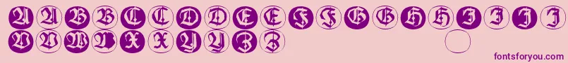 フォントFrakturinitialenangularround – ピンクの背景に紫のフォント