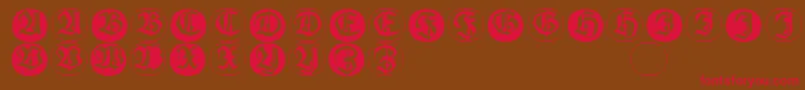 Frakturinitialenangularround-fontti – punaiset fontit ruskealla taustalla