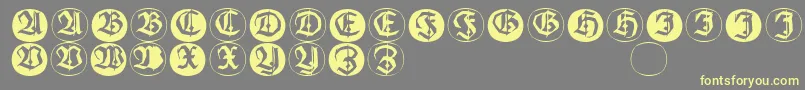 Frakturinitialenangularround-Schriftart – Gelbe Schriften auf grauem Hintergrund