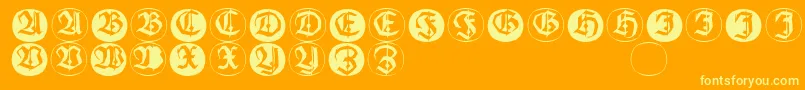 Frakturinitialenangularround-fontti – keltaiset fontit oranssilla taustalla