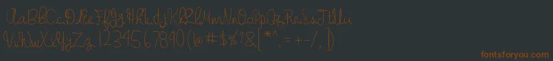 GabbisHandwriting-fontti – ruskeat fontit mustalla taustalla