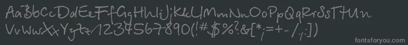 フォントBetinascriptc – 黒い背景に灰色の文字