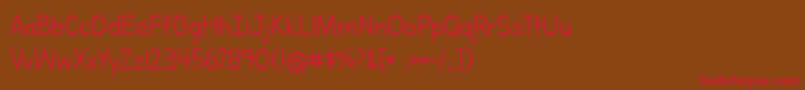 LettersForLearnersLinedHattedJ Font – Red Fonts on Brown Background