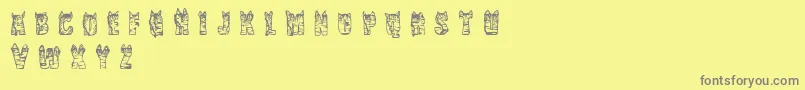 CfnaviaRegular-fontti – harmaat kirjasimet keltaisella taustalla