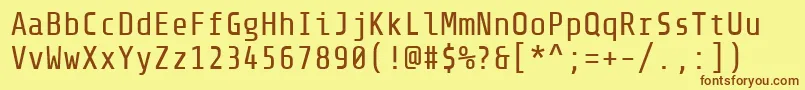 フォントShareTechmono – 茶色の文字が黄色の背景にあります。