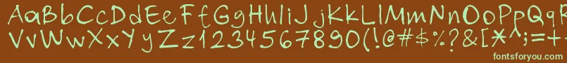 フォントNihat – 緑色の文字が茶色の背景にあります。