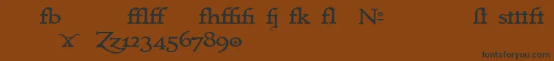 フォントImmrtlt – 黒い文字が茶色の背景にあります