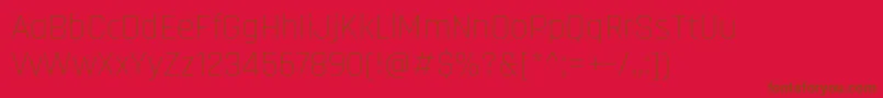 RajdhaniLight-fontti – ruskeat fontit punaisella taustalla