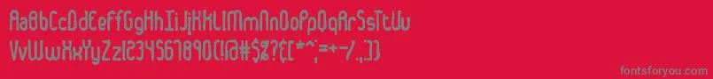 フォントDentedBrk – 赤い背景に灰色の文字