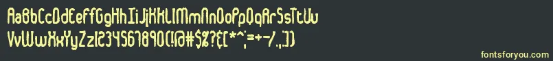 フォントDentedBrk – 黒い背景に黄色の文字