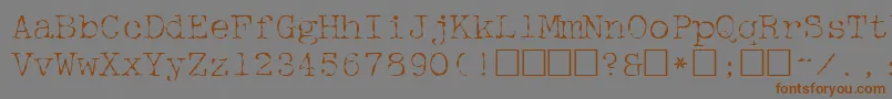 McgareyRegular-Schriftart – Braune Schriften auf grauem Hintergrund