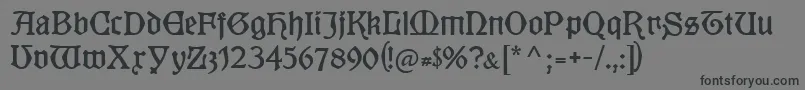 Kuenstlergotisch-fontti – mustat fontit harmaalla taustalla