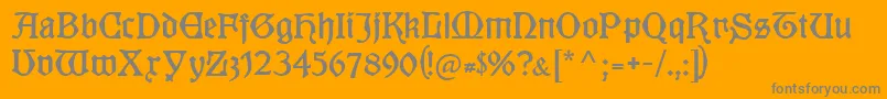 Kuenstlergotisch-Schriftart – Graue Schriften auf orangefarbenem Hintergrund