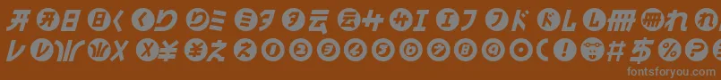 HamangairregularllItalic-fontti – harmaat kirjasimet ruskealla taustalla