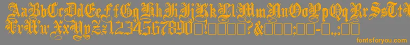 IncisedBlack-Schriftart – Orangefarbene Schriften auf grauem Hintergrund