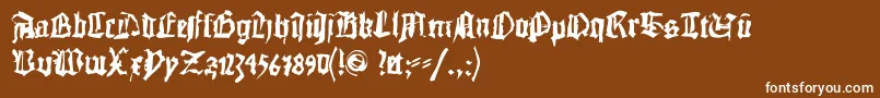 フォントDoublebrokentextura – 茶色の背景に白い文字