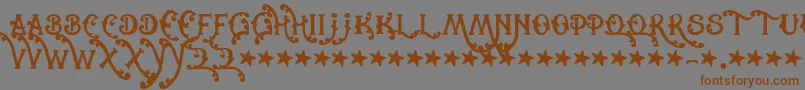 Czcionka Cowboyrhumbahut – brązowe czcionki na szarym tle