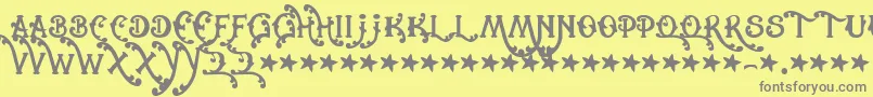 Cowboyrhumbahut-fontti – harmaat kirjasimet keltaisella taustalla