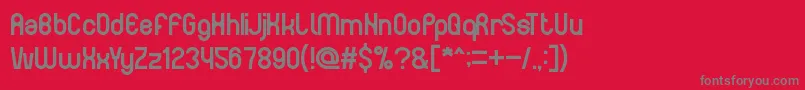 フォントTheHappyFaceSmile – 赤い背景に灰色の文字
