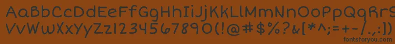 フォントShortstackRegular – 黒い文字が茶色の背景にあります