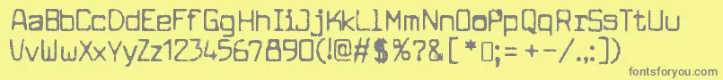 フォントCuomotypeRegular – 黄色の背景に灰色の文字