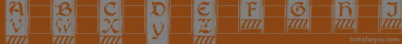 Boisterc-fontti – harmaat kirjasimet ruskealla taustalla
