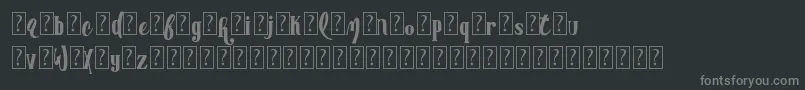 Fonte AdvertisingmasterDemo – fontes cinzas em um fundo preto