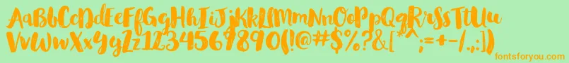 GlamourbrushRegular-Schriftart – Orangefarbene Schriften auf grünem Hintergrund