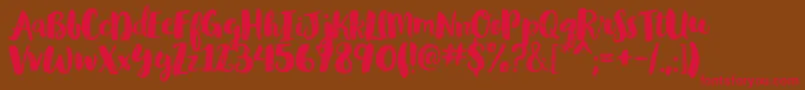 GlamourbrushRegular Font – Red Fonts on Brown Background