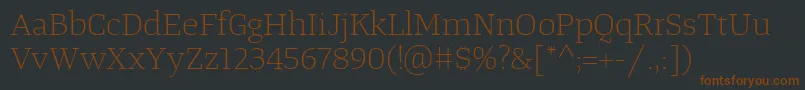Шрифт TangerserifwideulLight – коричневые шрифты на чёрном фоне