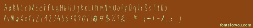 フォントWickedChild – 緑色の文字が茶色の背景にあります。