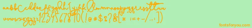 フォントCestlaisabelly – オレンジの文字が緑の背景にあります。