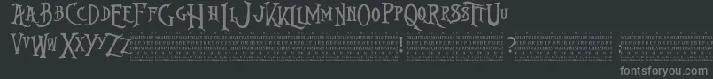 NightmareBeforeChristmas-fontti – harmaat kirjasimet mustalla taustalla