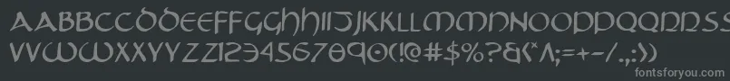 フォントTristram – 黒い背景に灰色の文字