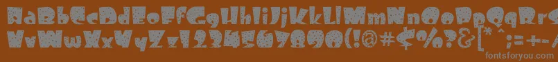 Freckle Font – Gray Fonts on Brown Background